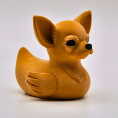 Dog-shaped rubber duck on a white background