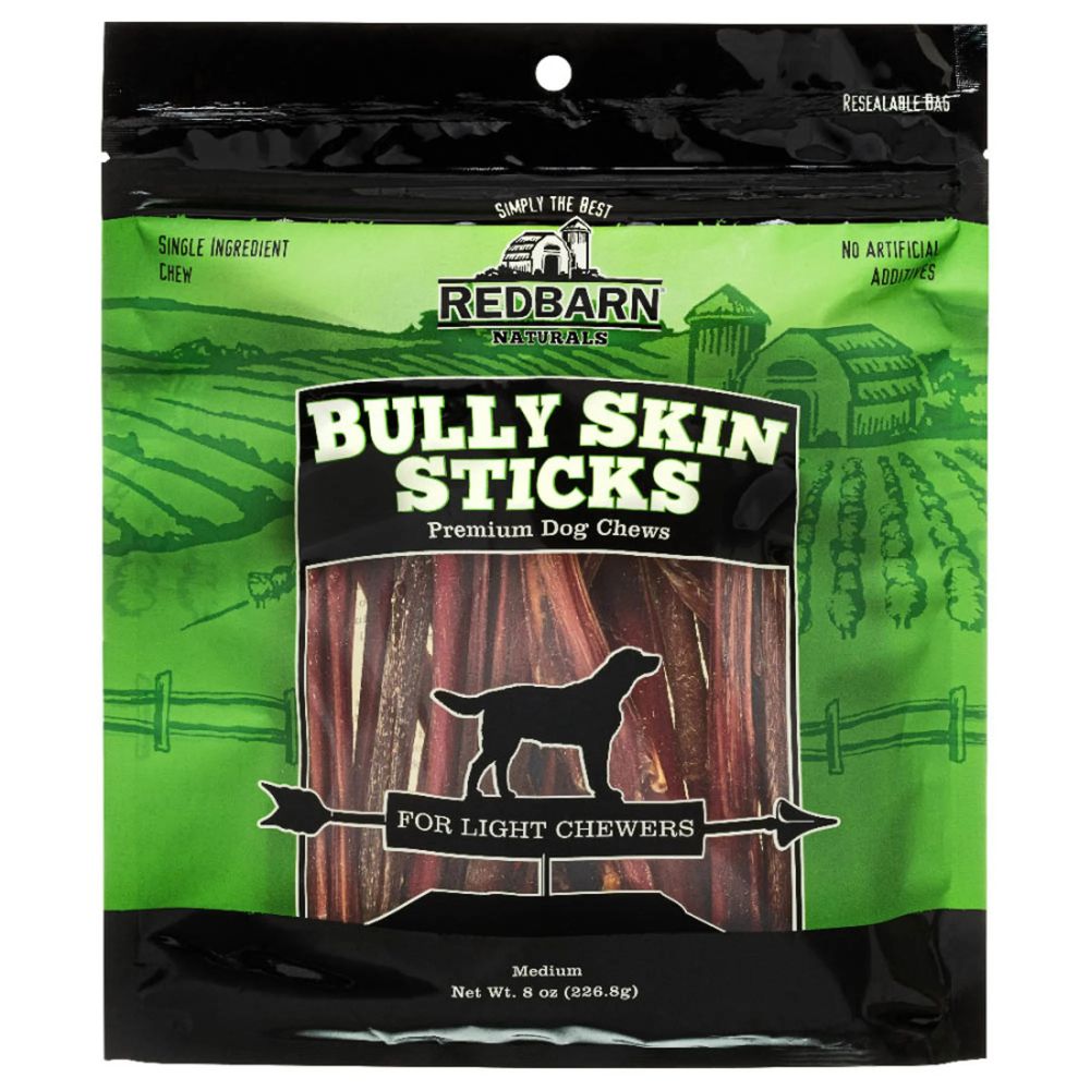 Package of Redbarn Bully Skin Sticks dog chews on a green and black background