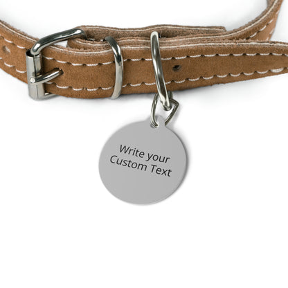 Brown leather dog collar with a metal tag on a white background